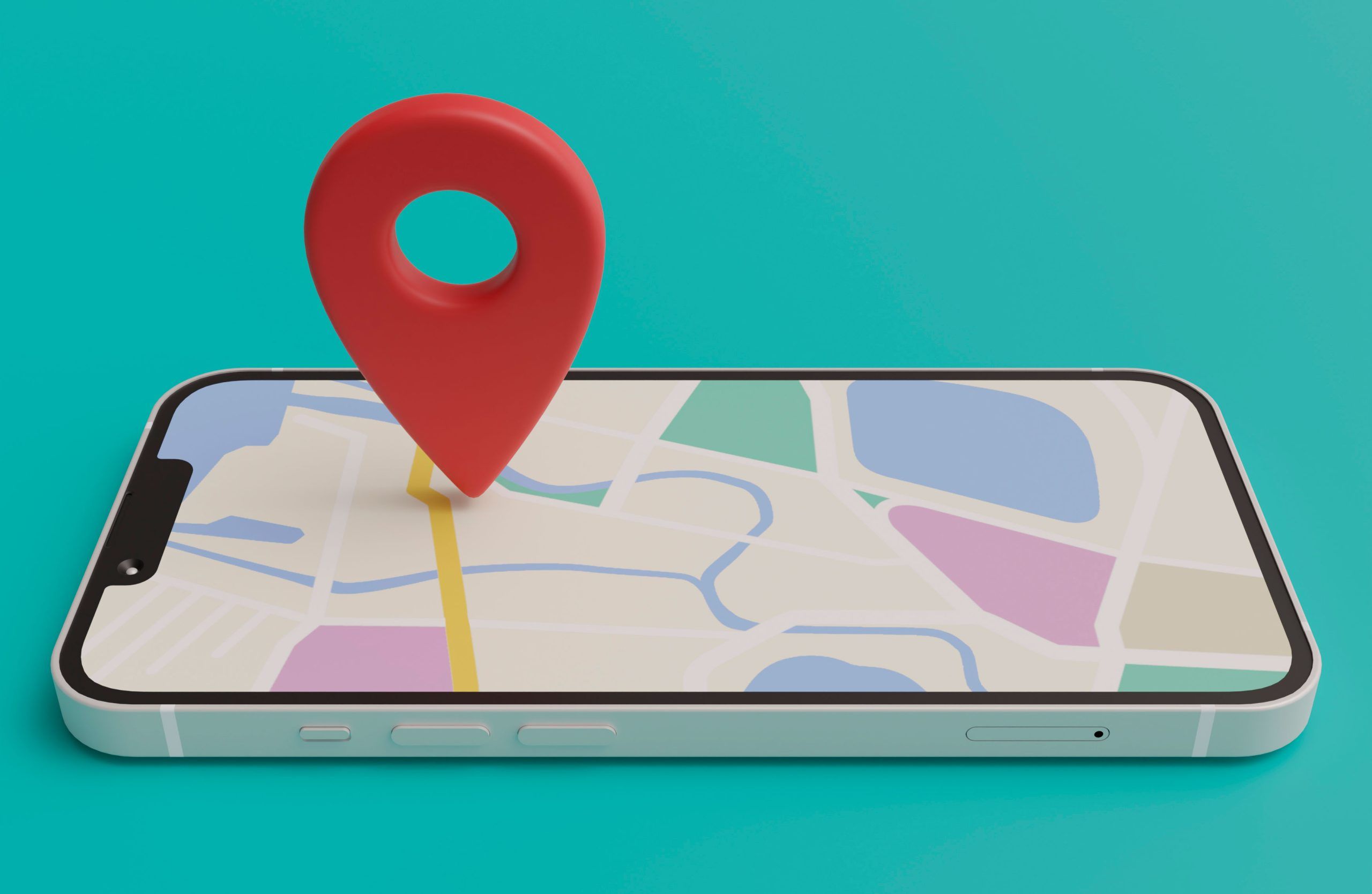 Smartphone deitado com tela exibindo um mapa e um marcador de localização vermelho sobre ele, sobre fundo azul-turquesa.